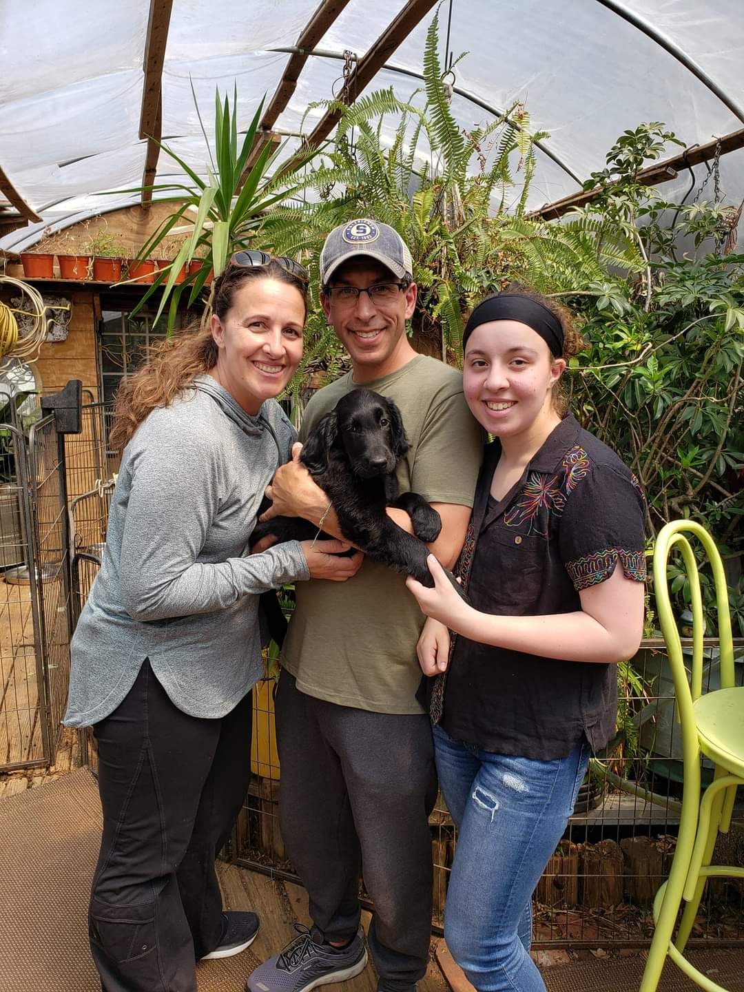 A Happy Family picking up their Argon's puppy