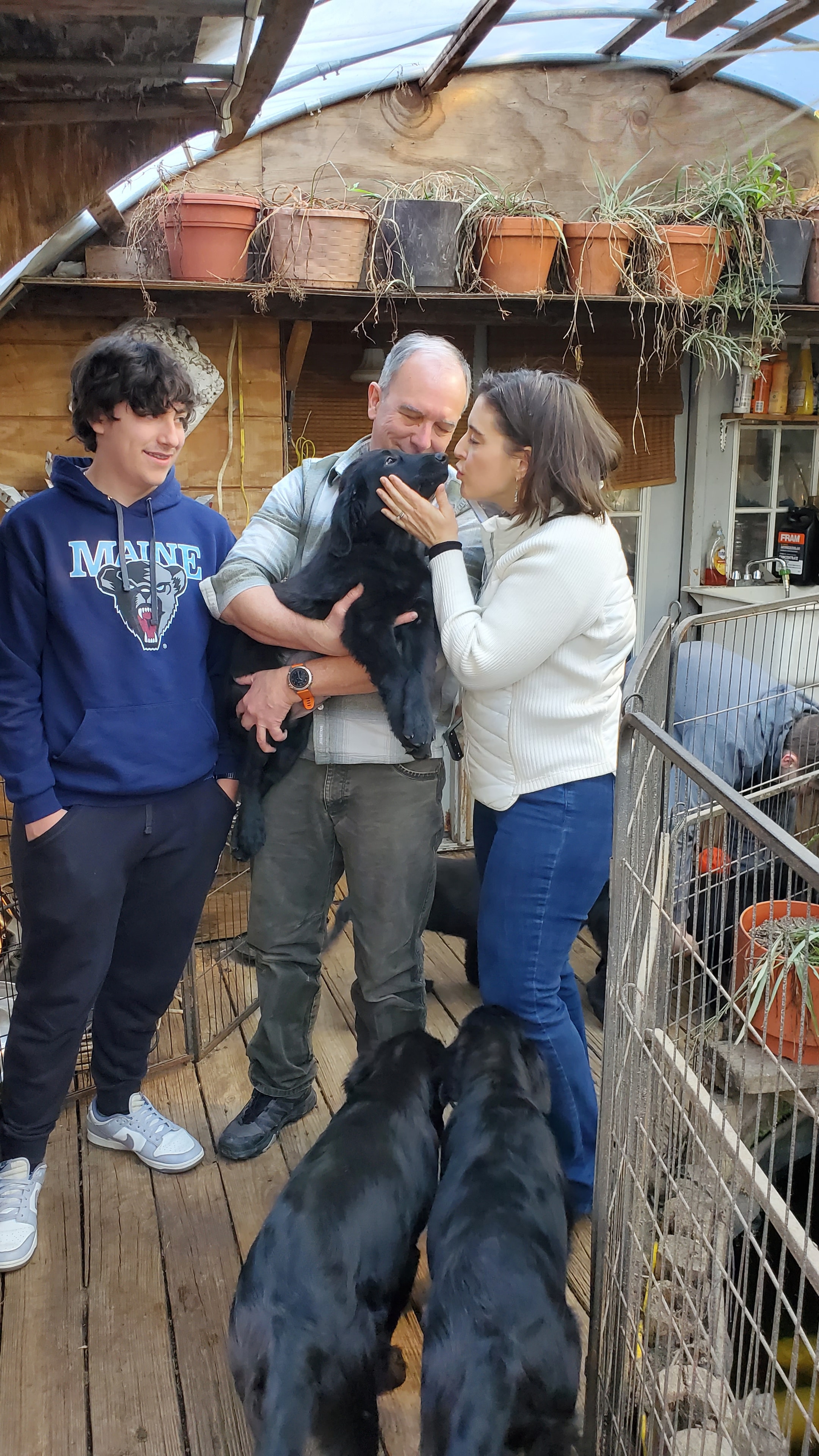 A Happy Family picking up their Argon's puppy