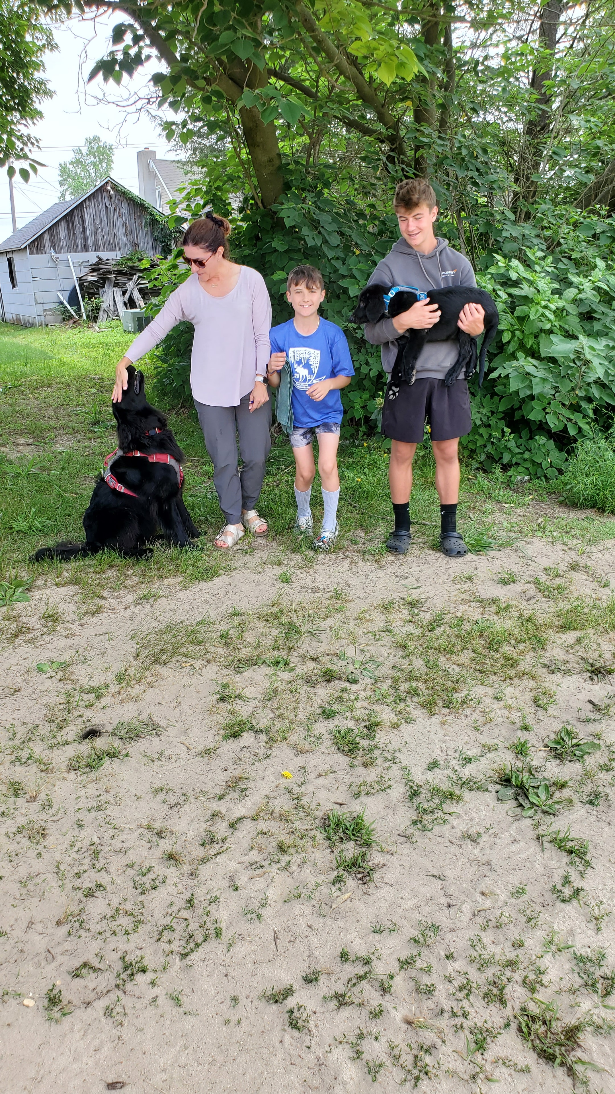 A Happy Family picking up their Argon's puppy