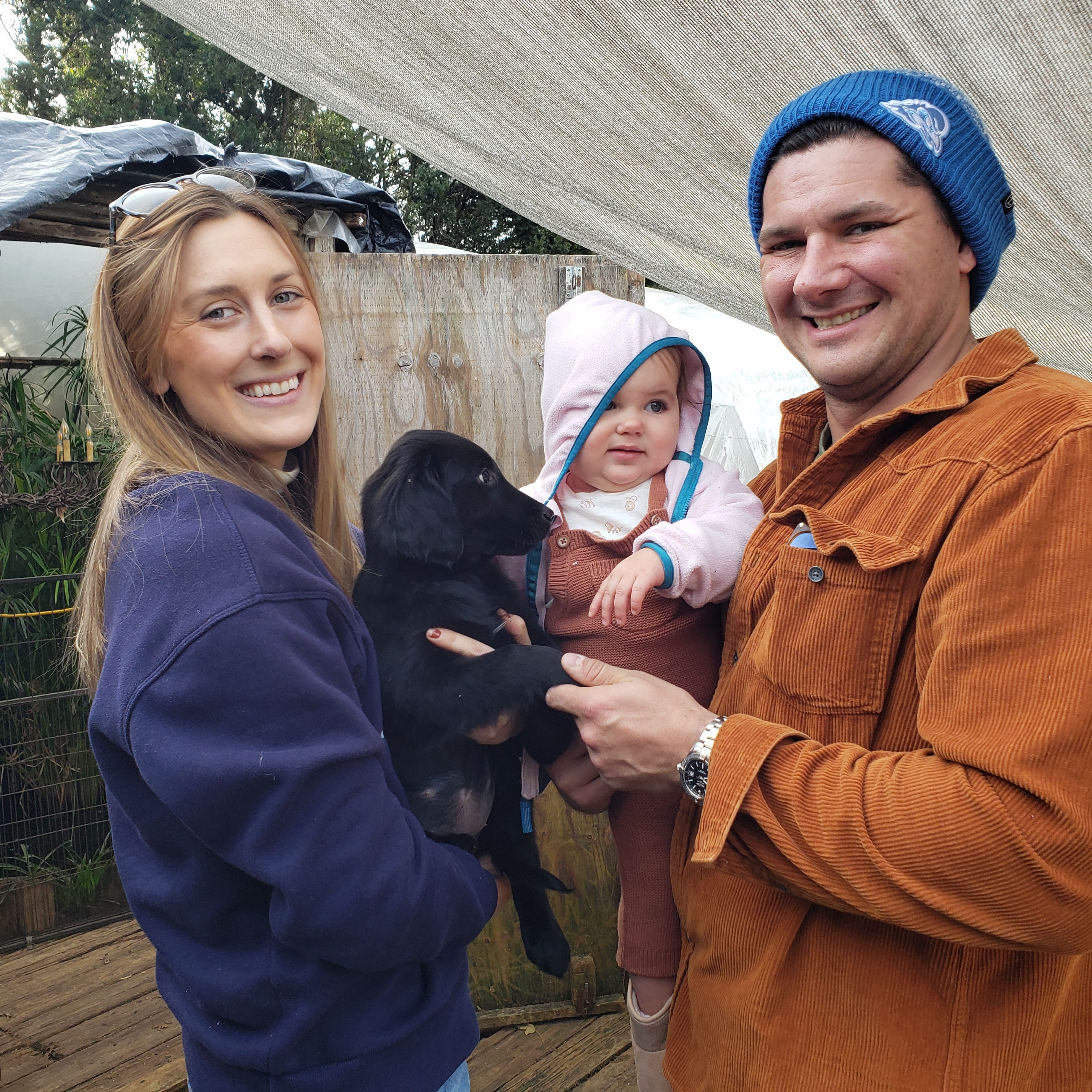 Happy family with their new puppy from Argon's
